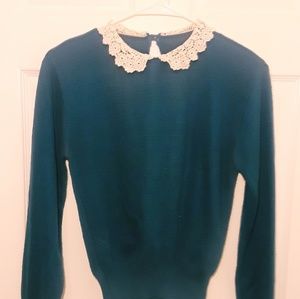 Blue sweater with white lace collar